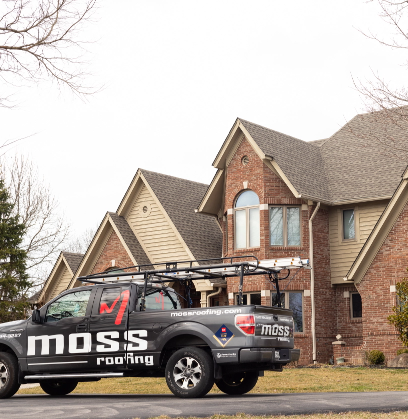 Moss Roofing truck outside of house